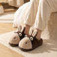 Chaussons ane peluche portes