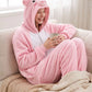 Combinaison pyjama cochon portée sur le canapé